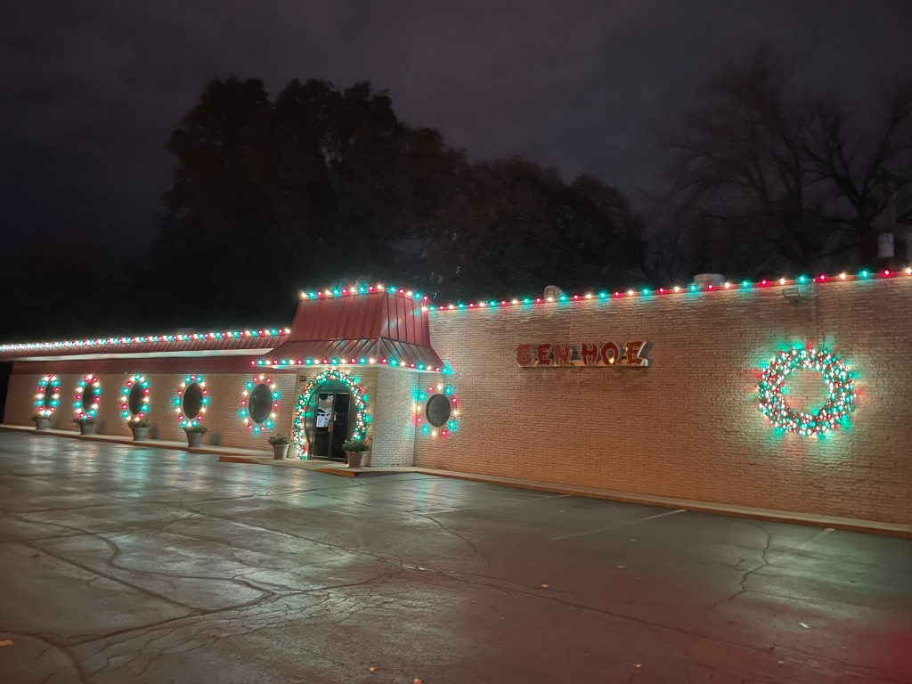 Commercial building with red and teal professional holiday lights