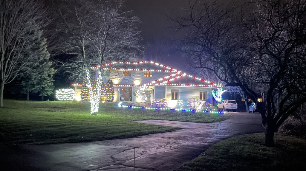 St Charles home decorated with red and white holiday lights